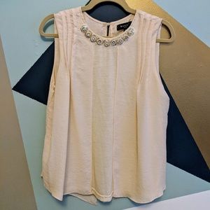 Soft pink top with embellished neckline